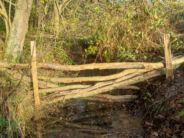 Leaky woody barriers made to slow water flow